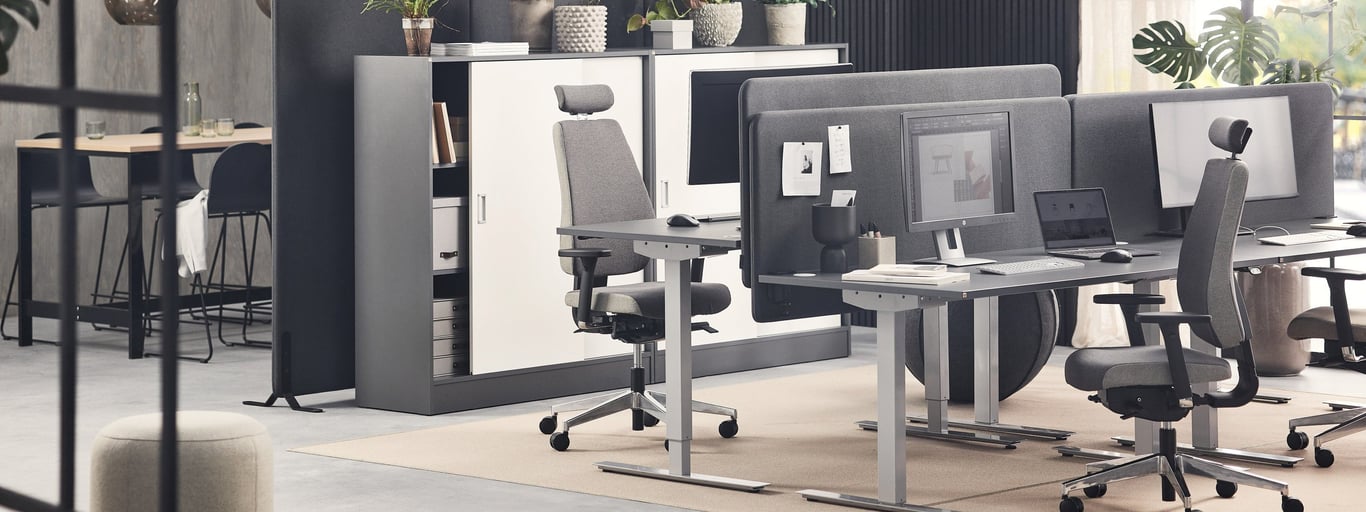 Height-adjustable desks in an office environment