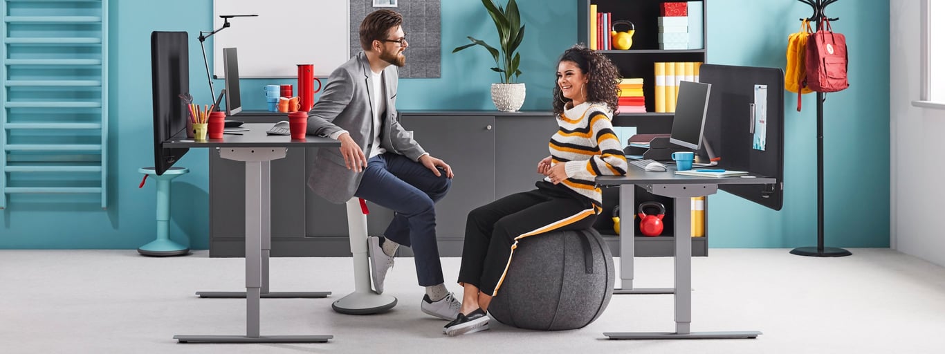 two people chatting while sitting on active seats