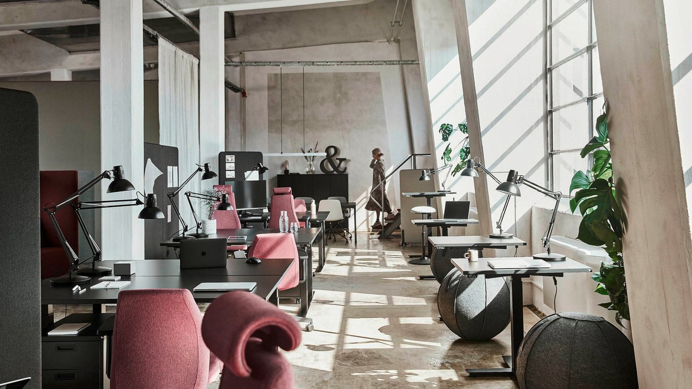 Open plan office space with desks and chairs