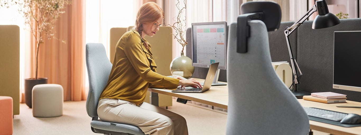 Lady sitting at a desk in her office