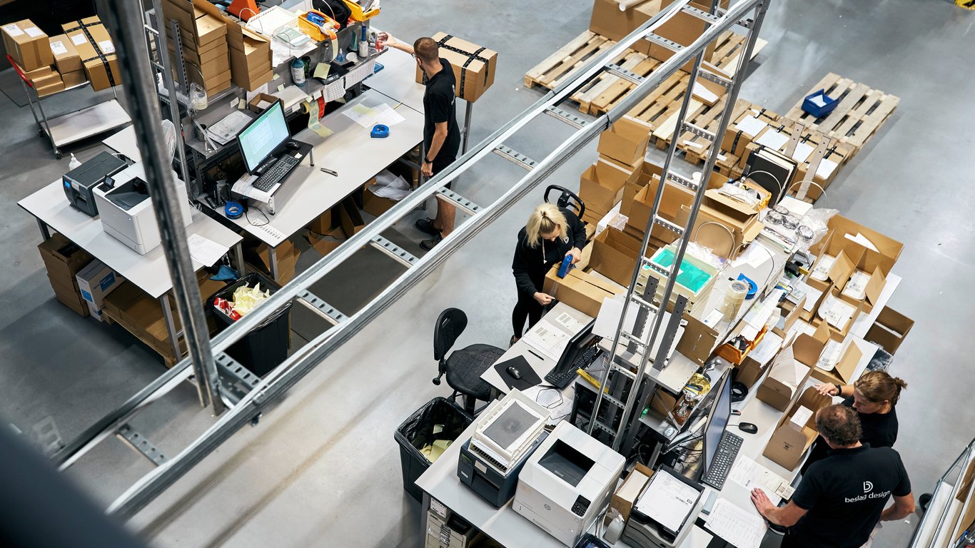 warehouse set up with packing table and shelves