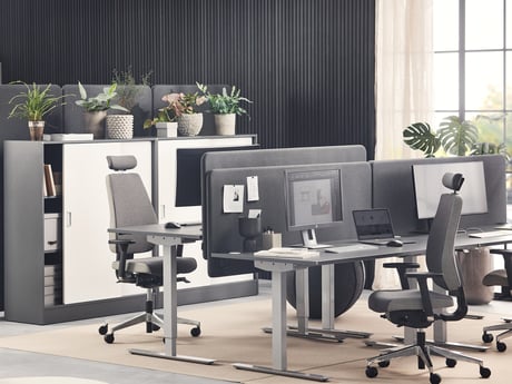 Height-adjustable desks in an office environment