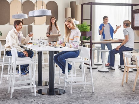 People interact with each other in an office