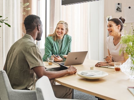 Three people meeting in a conference room