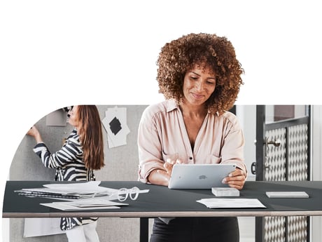 Woman standing to work at a standing meeting table