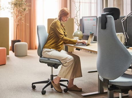 Lady sitting at a desk in her office