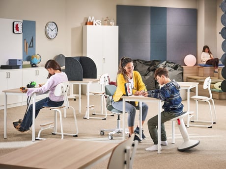 students and teacher with sensory classroom furniture