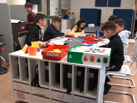 Children studying at school desks