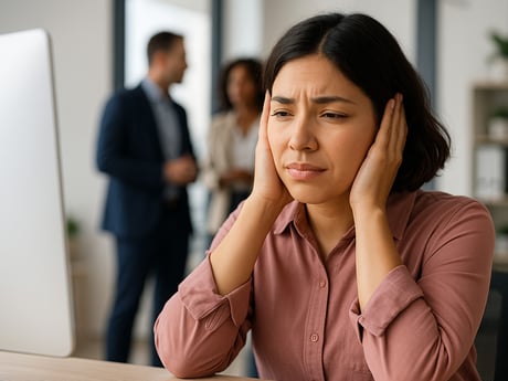 a lady covering her ears in disconfort
