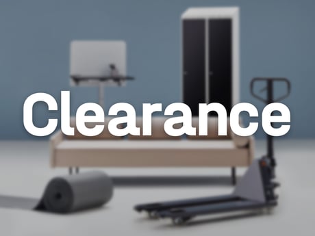 The word "clearance" in white text on a background featuring an assortment of workplace furniture and equipment including a locker, sofa an pallet truck.