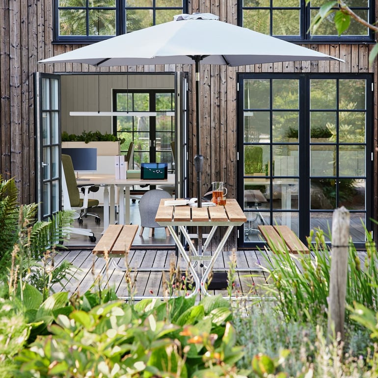 picnic bench and a parasol help enjoy the sunny days in your workplace