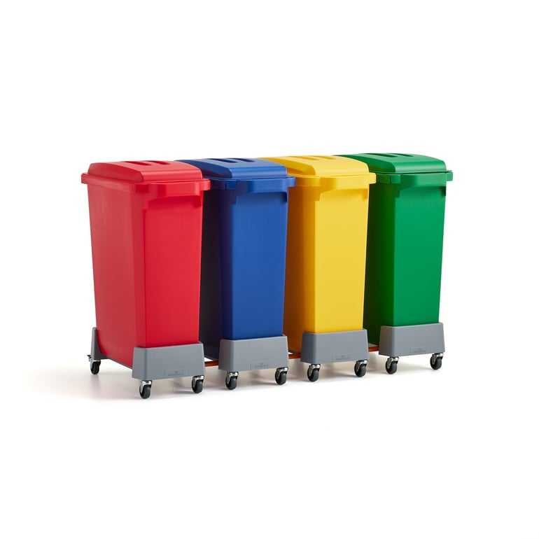 Four coloured recycling bins connected on trolleys