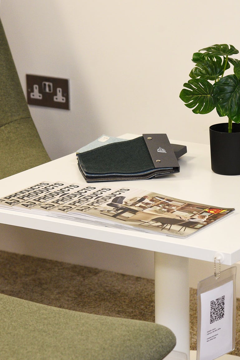 AJ Products corporate catalogs and furniture fabric swatches on display at the office showroom in Farnborough