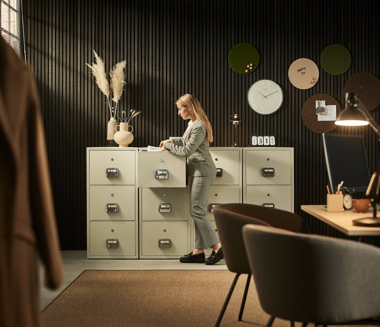 a person searching files in a fireproof filing cabinet SHELL