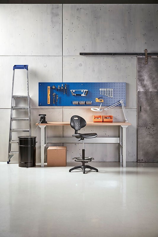 A workspace with a workbench and a classic factory chair KILDA