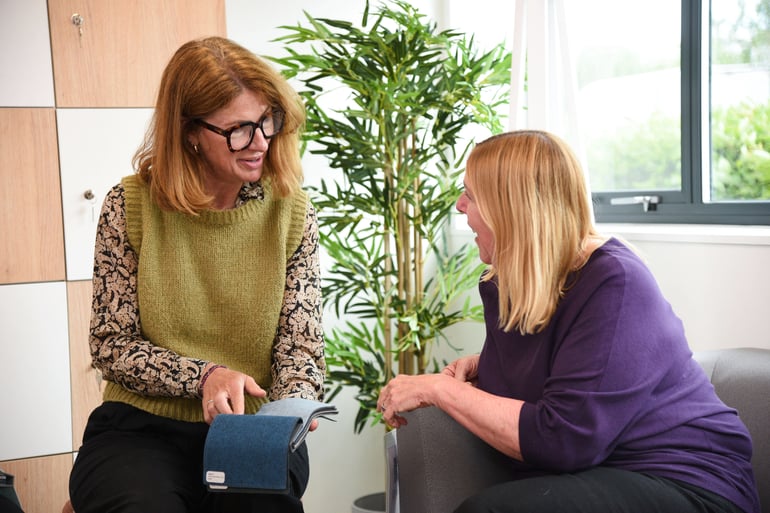 Workplace furniture advisor helping client choose office furniture in farnborough showroom