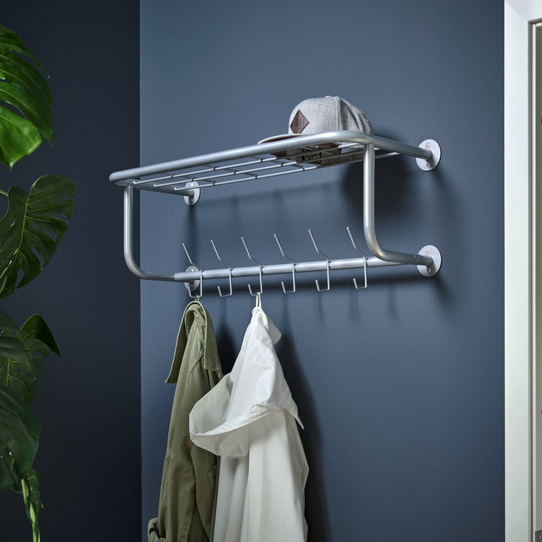 Wall mounted coat rack with hanging coats