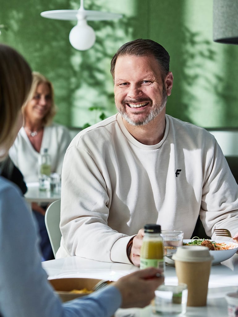 a staff member enjoying a healthy meal at the canteen