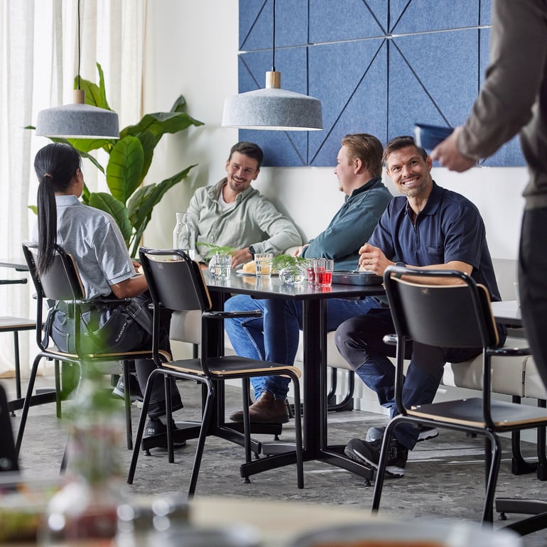 staff members socialising in the canteen space