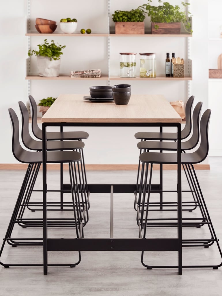 Canteen table and poseur chairs in a company canteen