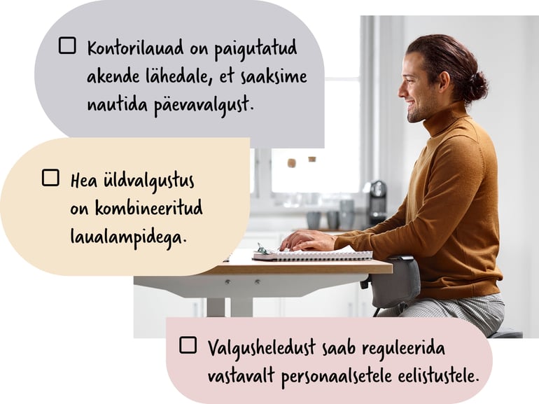 Inimene istub valgusküllases keskkonnas kontorilaua taga