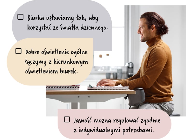 Mężczyzna siedzący przy biurku w jasnym otoczeniu