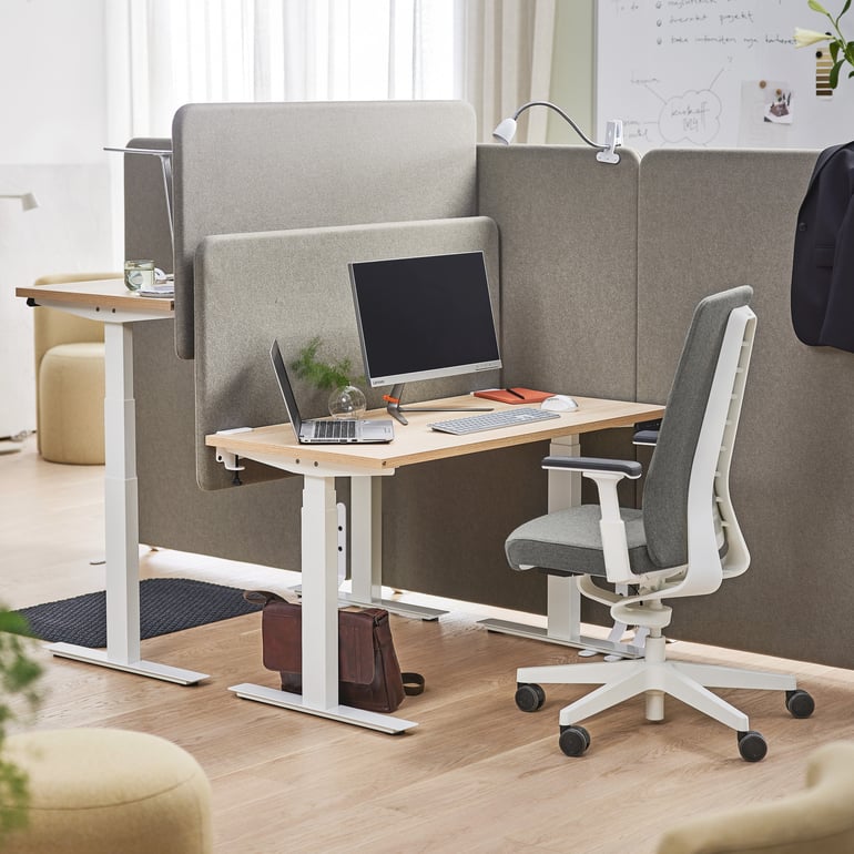 a workplace set up with acoustic features, sound absorbing desk screens and acoustic wall panels