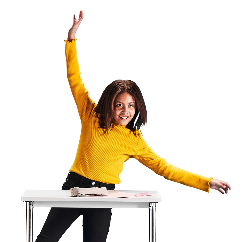 Girl standing behind a desk