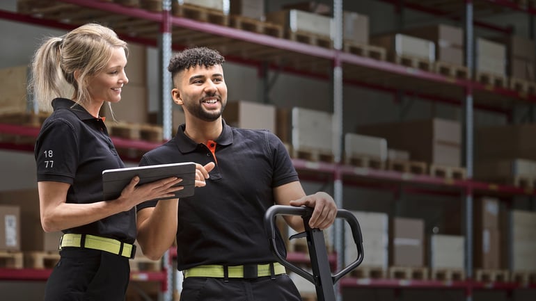 Two people in warehouse