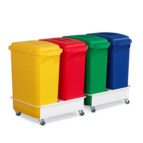 Yellow, red, green and blue waste containers on a trolley with casters