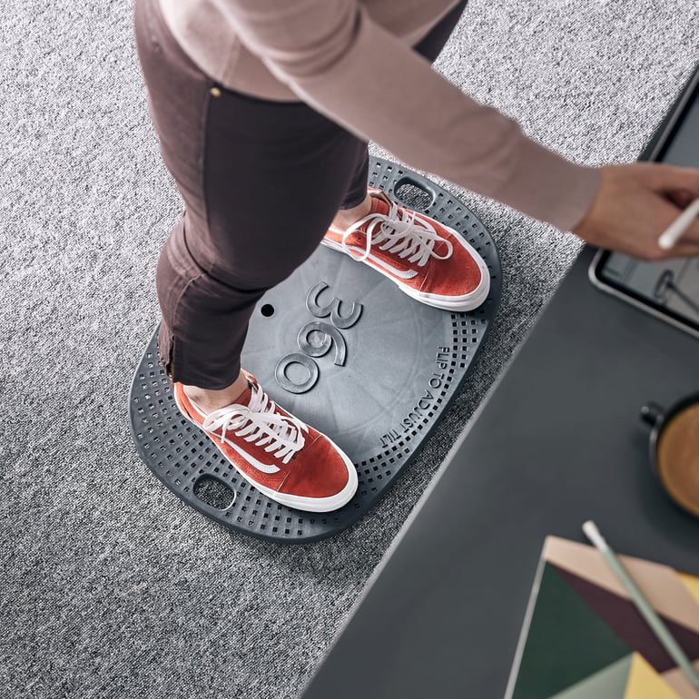 A balance board is used for standing desk work