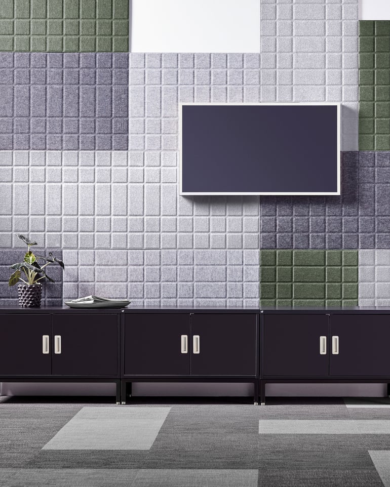 Wall covered with acoustic panels in different colours