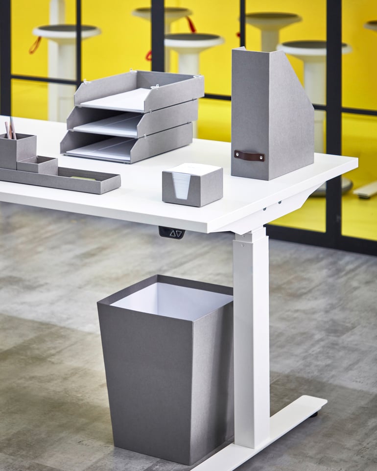 : A well-organised desk with matching letter tray, desk stand, magazine rack, note cube and waste bin.