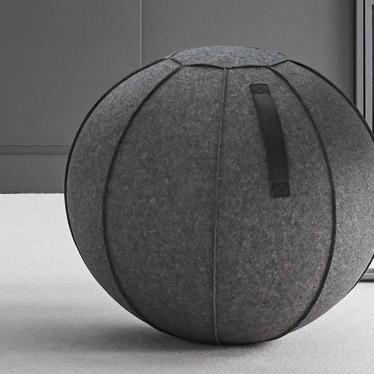 Pilates balance ball with grey fabric covering