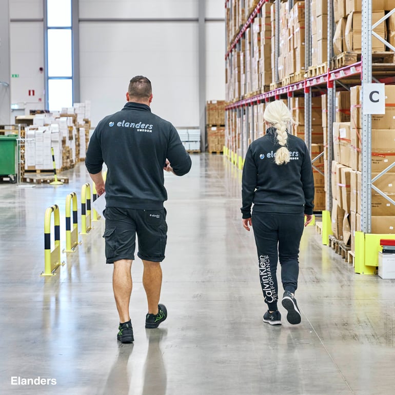 People walking in a warehouse