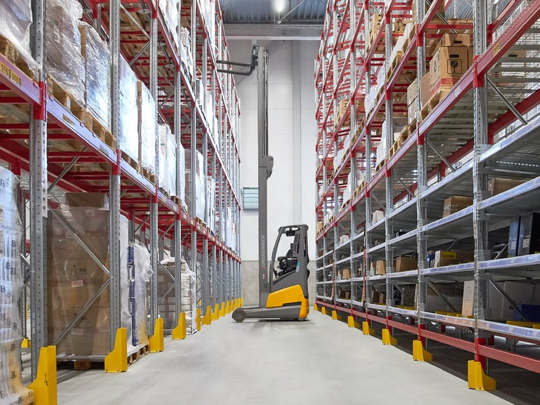 Forklift truck picking items in a warehouse