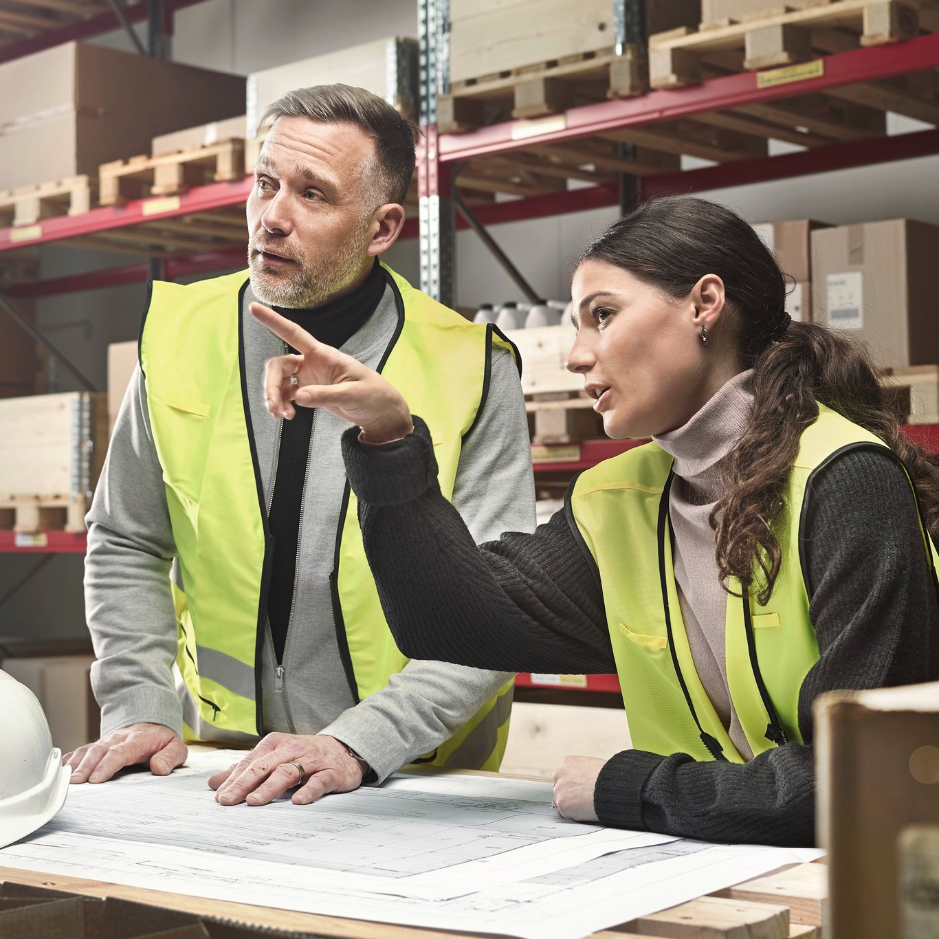 People in hi vis in warehouse