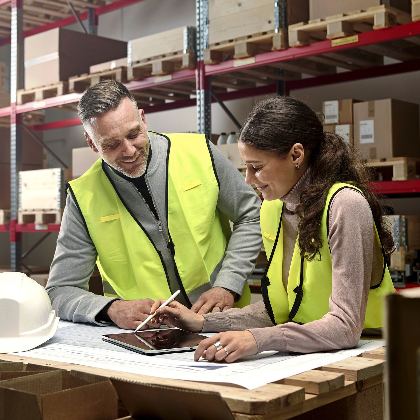 People in high vis in a warehouse