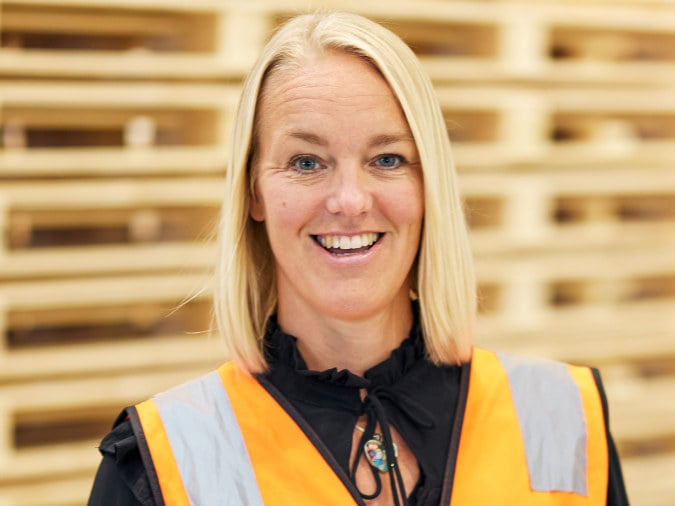 Head shot of woman wearing a hi-vis vest