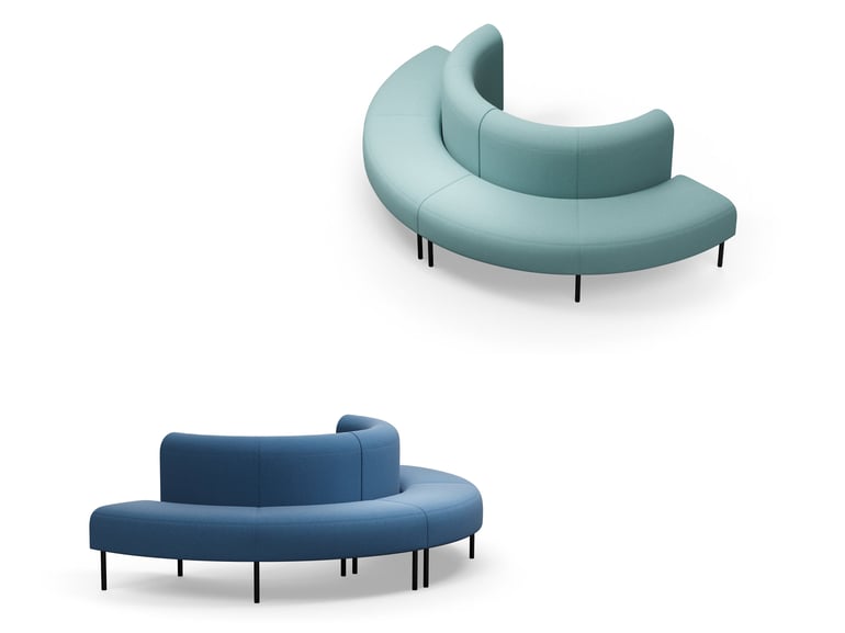 Two curved sofas, one blue, one green, on a white background