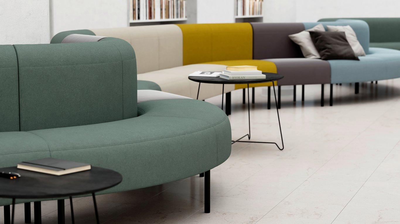 Long curved sofa with different coloured modules