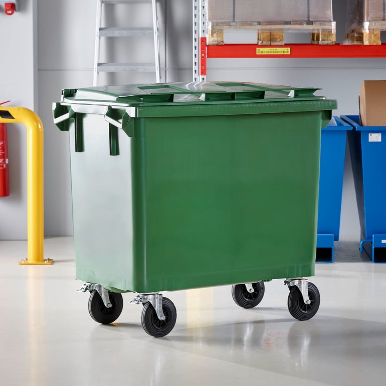 Large green wheelie bin in a warehouse