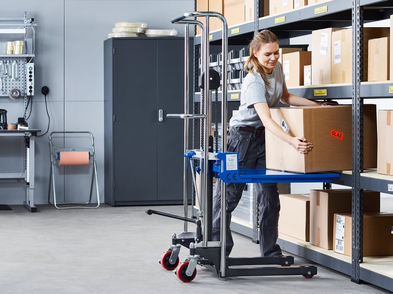 Woman lifting box