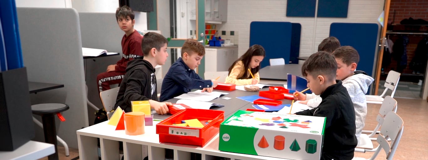 Children studying at school desks