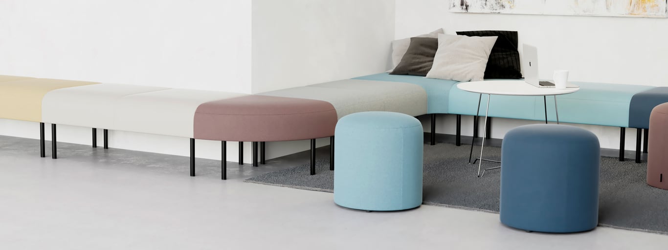 Breakout space with colourful bench seats and pouffes