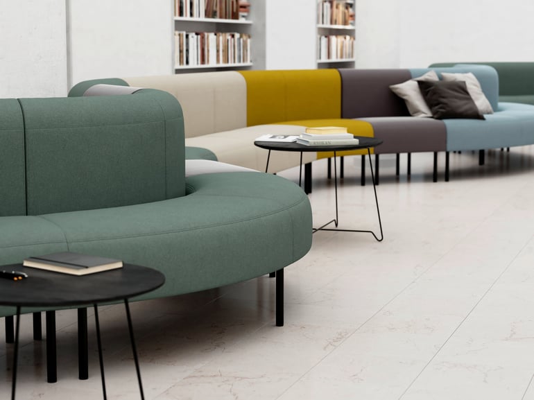 Long curved modular sofa with different coloured modules