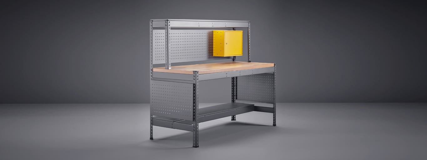 Steel workbench with tool panels, top shelf and small cabinet