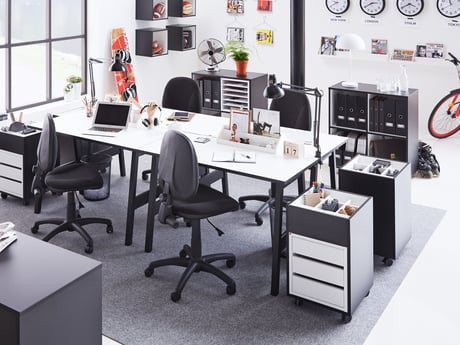 Open plan office with desks and office chairs
