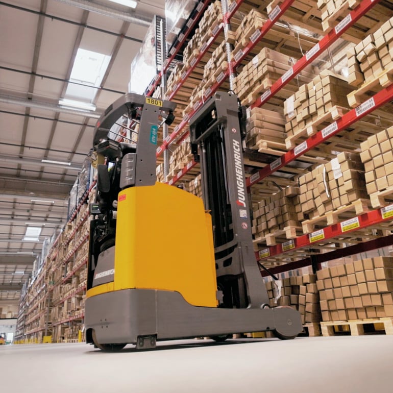 Stacker picking goods in a warehouse