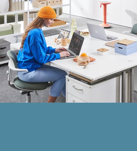 Woman working on a laptop at a desk